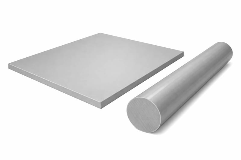 A grey polypropylene sheet lying flat beside a length of grey polypropylene rod, the rod's cut end to camera